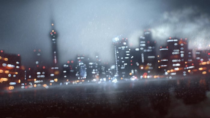Blurred cityscape at night with rain