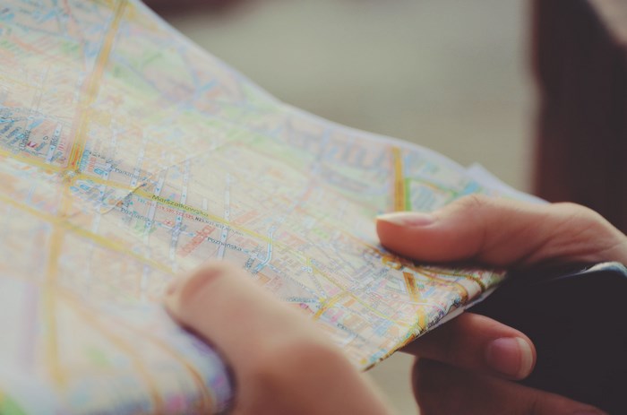 Person holding a map with street names