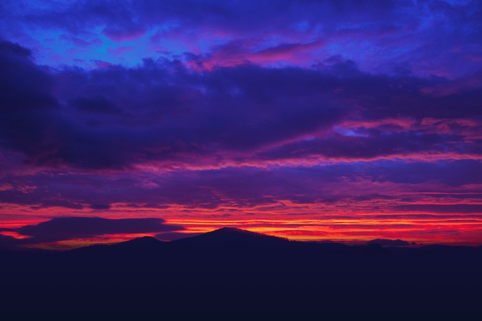 Vibrant Red and Purple Mountain Sunrise