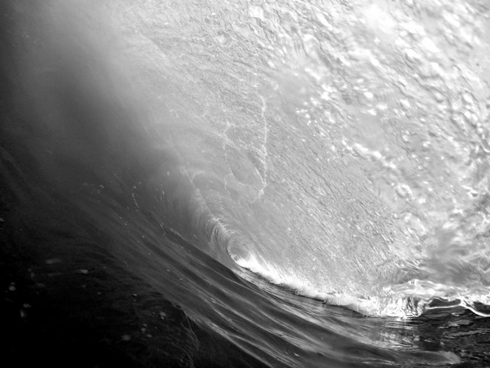 Black and white close-up of a breaking ocean wave