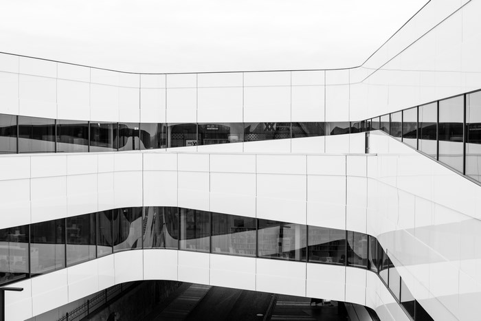 Modern white building with geometric windows in Umeå, Sweden