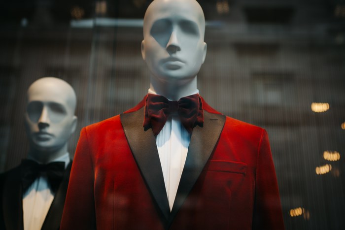 Red velvet tuxedo mannequin with bow tie