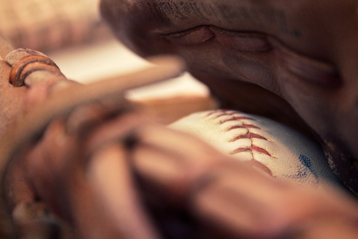 Close-up of a baseball in a glove