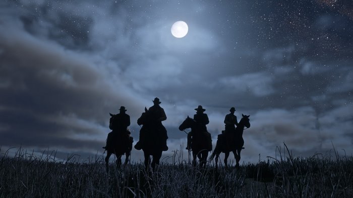 Silhouettes of cowboys on horses under a full moon in Red Dead Redemption 2