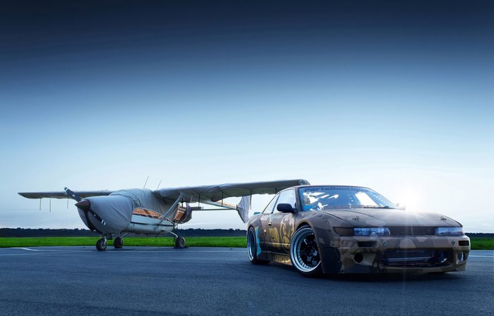 Nissan Silvia S13 and airplane on airport tarmac