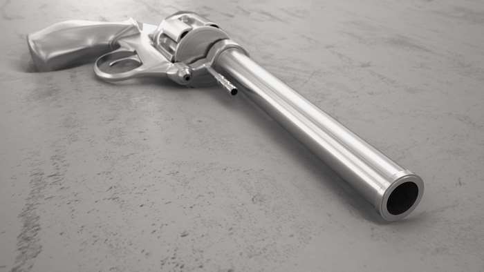 Silver revolver on a textured surface