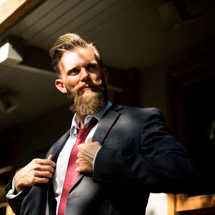 Man with beard and mustache in suit and tie