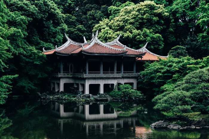Traditional Japanese Temple by a Serene Forest Lake