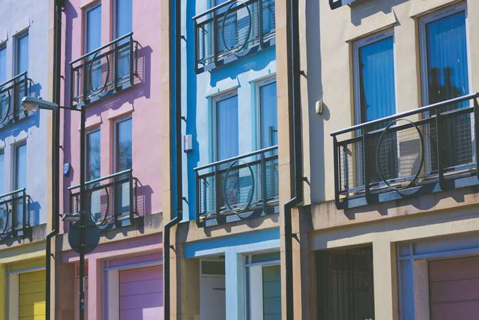 Colorful apartment buildings with balconies and windows