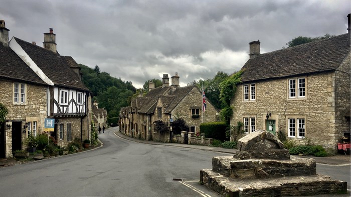 Castle Combe village with stone cottages and a road