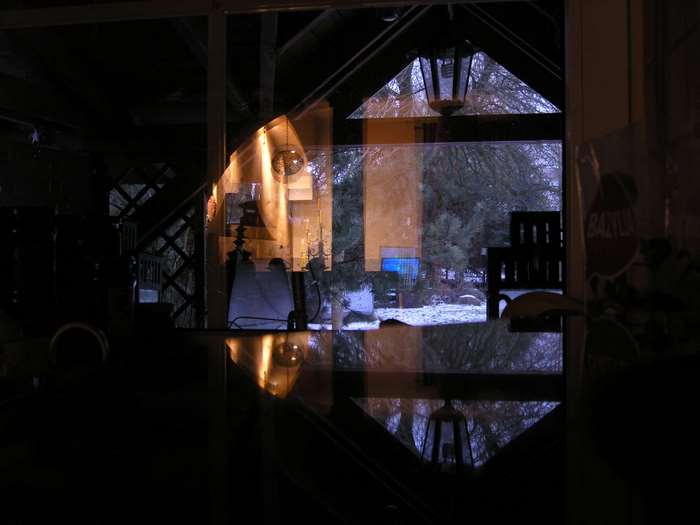 Reflection of a winter scene through a window
