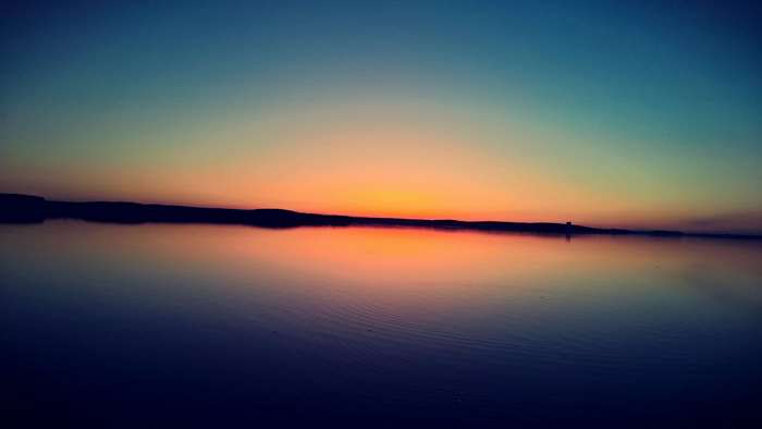 Calm lake at sunset 4K