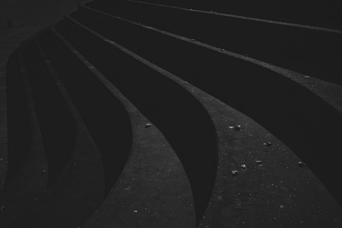 Abstract curved concrete steps in black and white