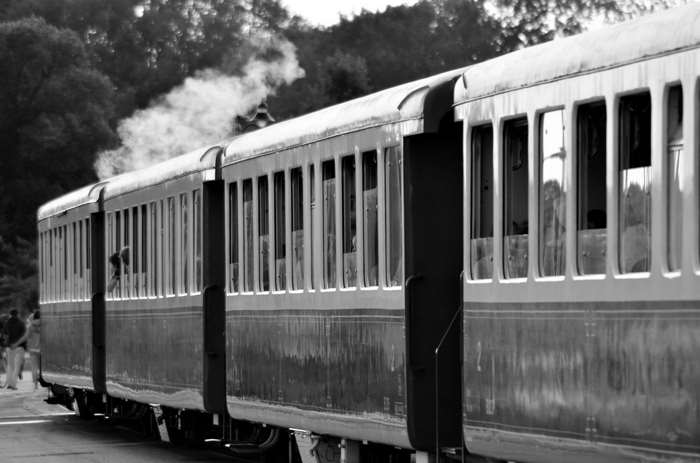 Steam train with smoke in black and white