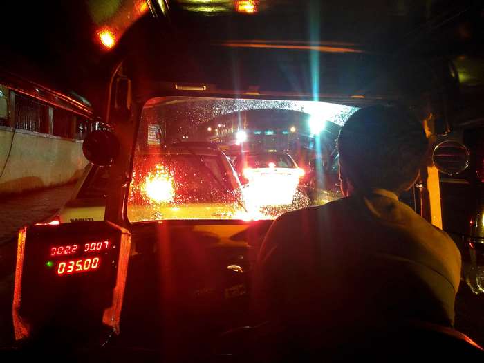 Auto rickshaw at night in Mumbai traffic
