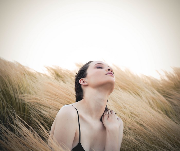 Woman in a field of tall grass