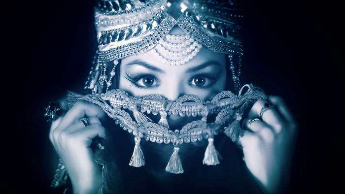 Woman in ornate headdress and veil