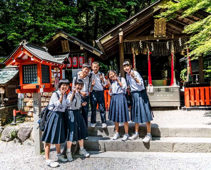 Japanese school children at a shrine in Arashiyama, Kyoto