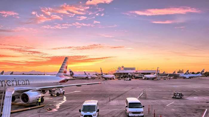 American Airlines airplane at airport during sunset