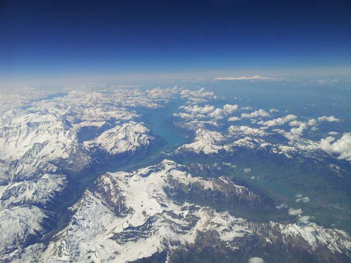 Aerial view of snow-capped mountains and a lake