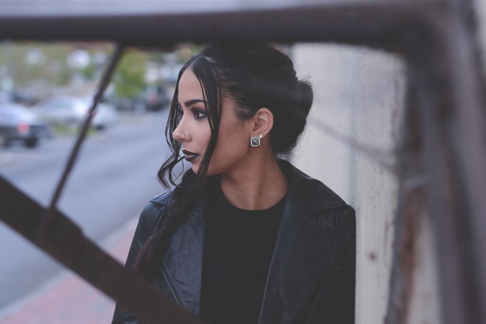Woman with black lipstick and leather jacket