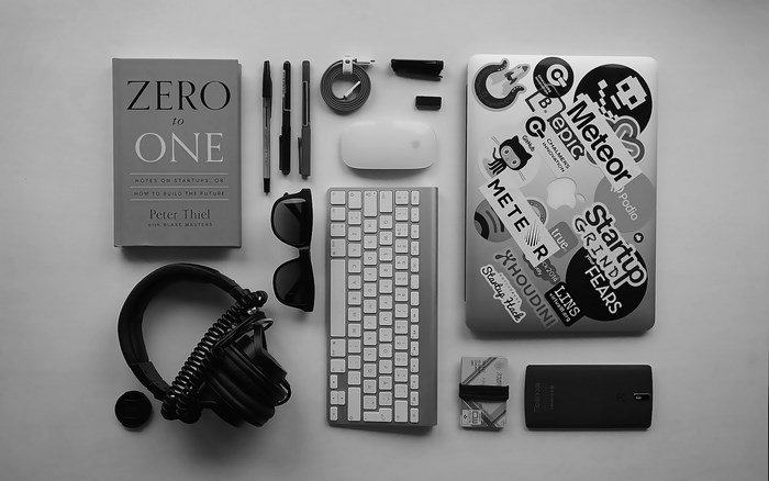 Peter Thiel's Zero to One book with tech accessories