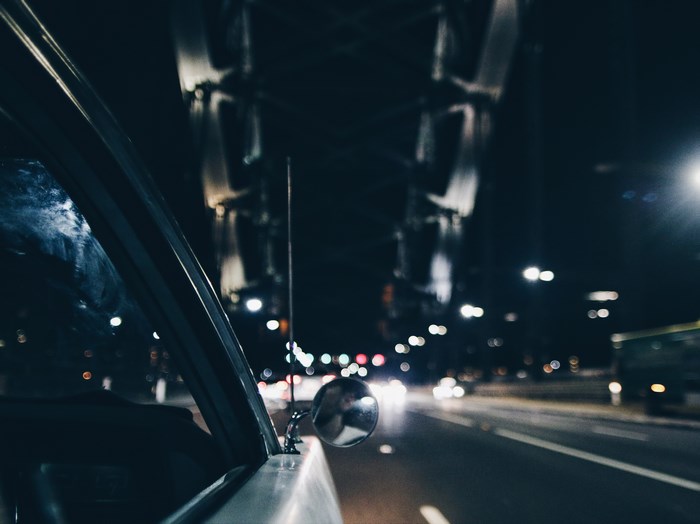 Driving under a bridge at night