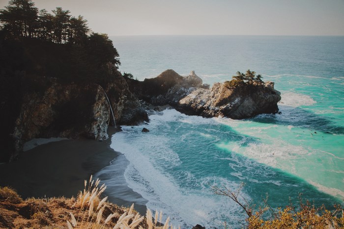 Waterfall cascading onto a beach in California