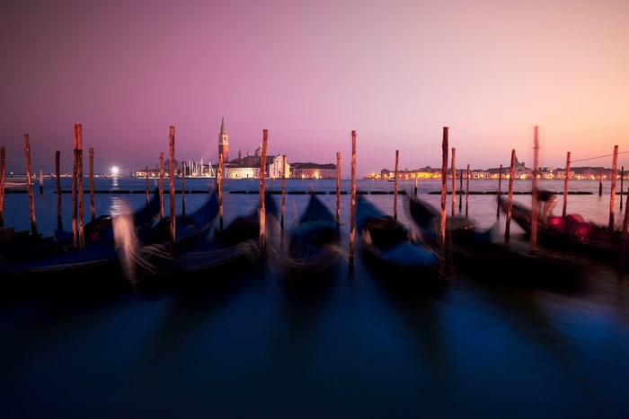 Venice gondolas at sunset with San Giorgio Maggiore