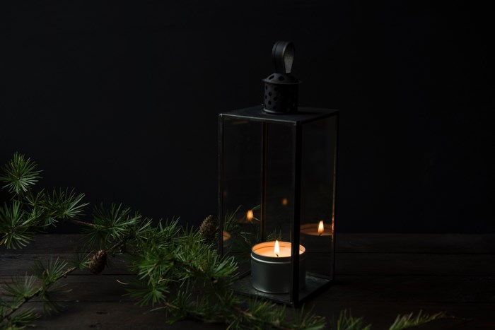 Lantern with a candle and pine branch