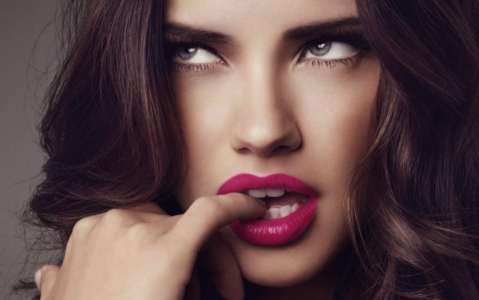 Adriana Lima with bright pink lipstick