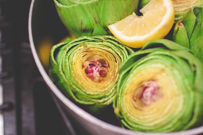 Artichokes and lemon in a pot