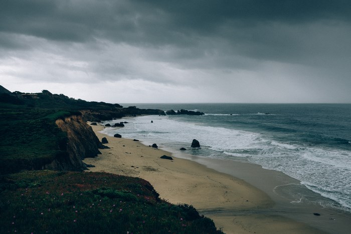 Stormy Coastline with Waves Crashing on a Sandy Beach