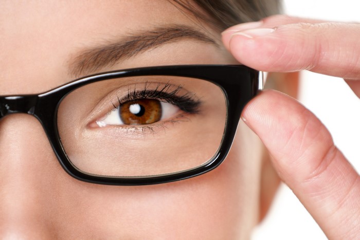 Close-up of a woman's eye wearing glasses