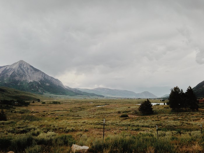 Overcast valley with mountains and trees
