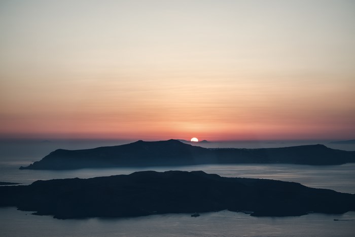 Sunset over islands in Greece