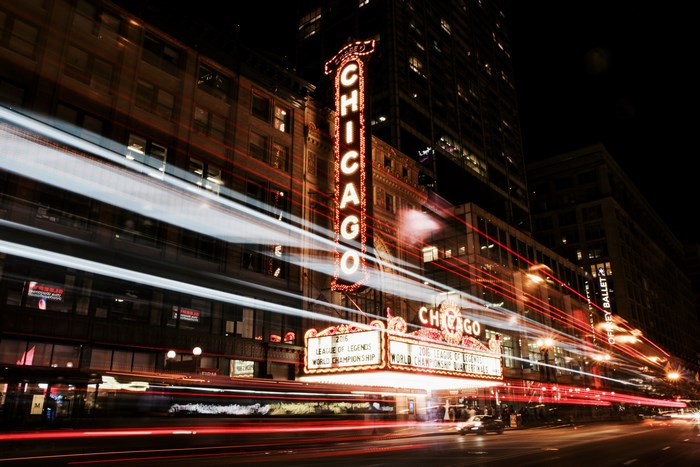Chicago Theatre at night with light trails