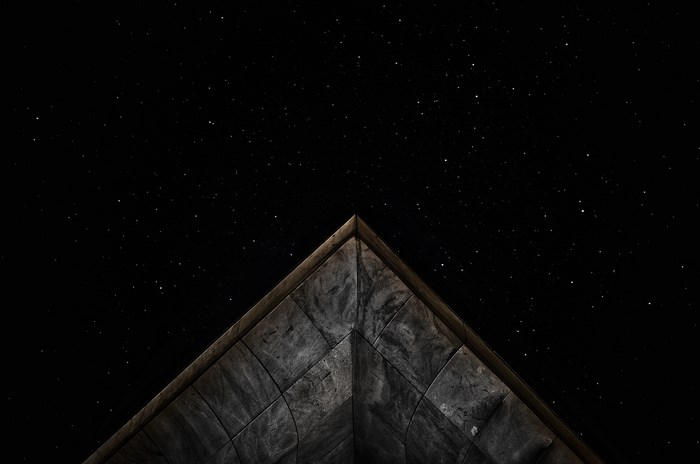 Concrete corner against a starry night sky
