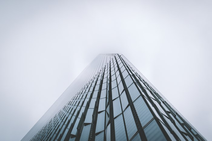 World Trade Center skyscraper in fog, looking up