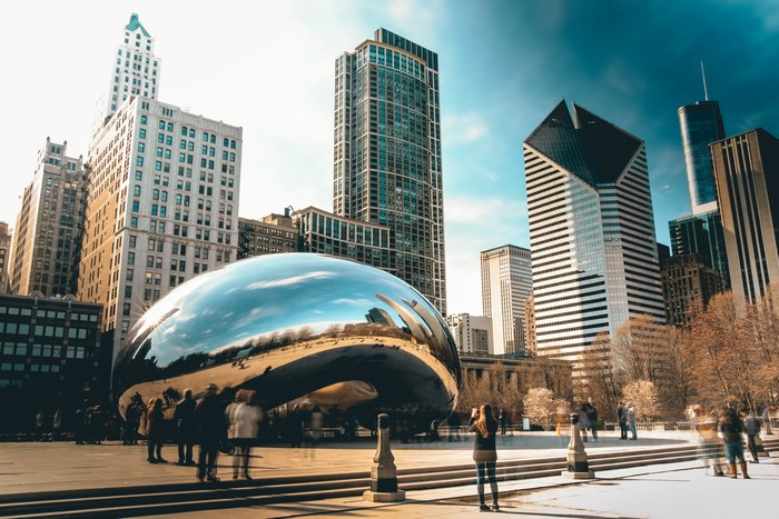 Cloud Gate sculpture in Chicago with skyscrapers