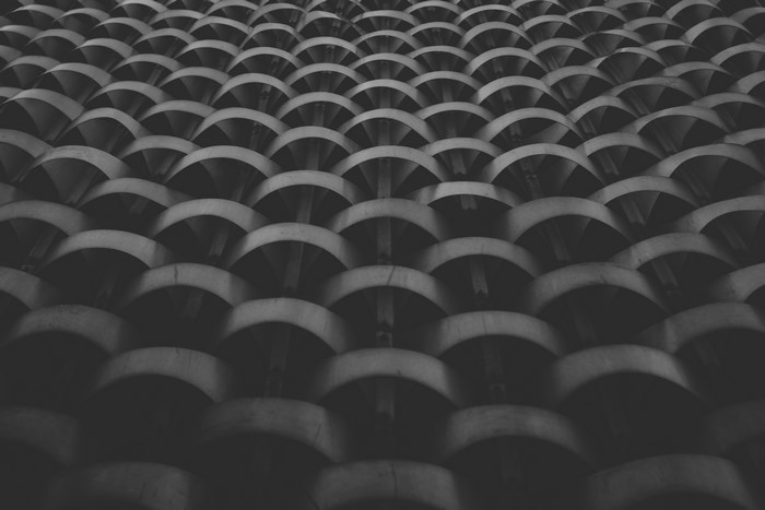 Abstract geometric pattern of repeating curved shapes
