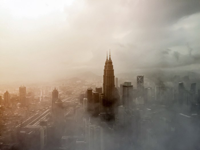 Kuala Lumpur skyline shrouded in fog