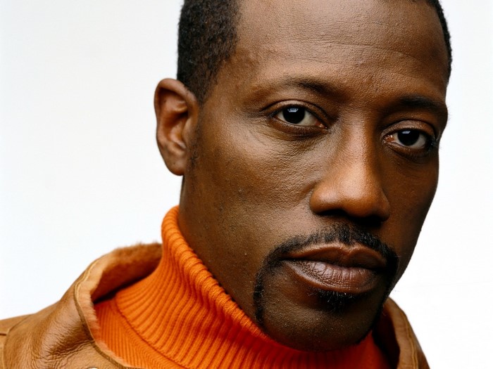 Wesley Snipes wearing an orange turtleneck