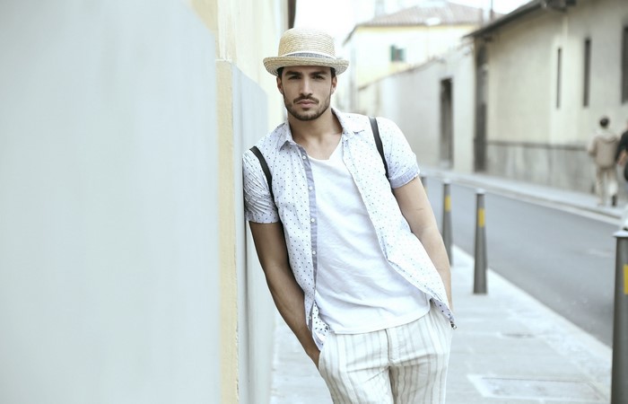 Mariano Di Vaio wearing a straw hat and patterned shirt
