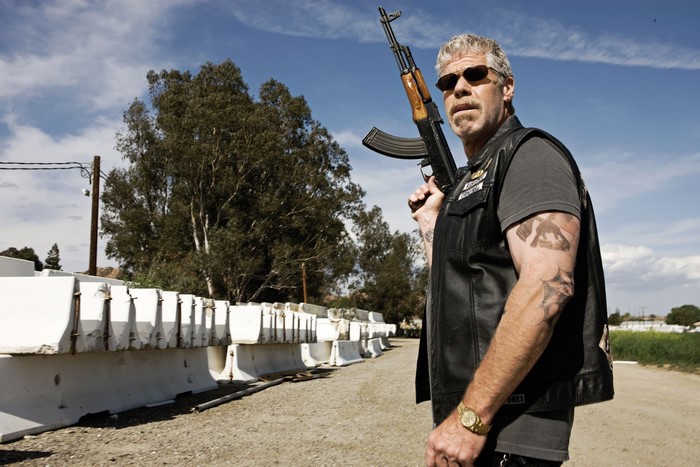 Ron Perlman as Clay Morrow from Sons of Anarchy with a Kalashnikov