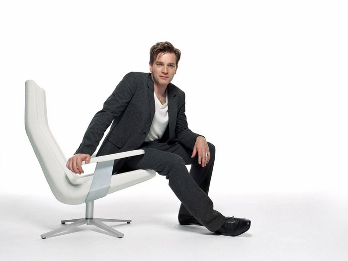 Ewan McGregor sitting in a modern chair