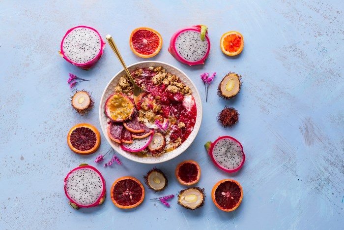 Tropical fruit bowl with granola and yogurt