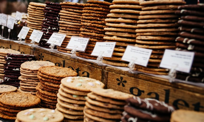 Stacks of cookies on display at a market