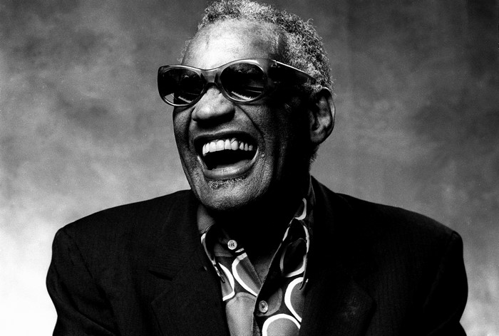 Ray Charles wearing sunglasses and a patterned shirt