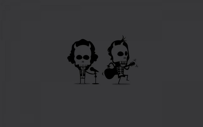 Two skeletons, one singing into a microphone, the other playing guitar
